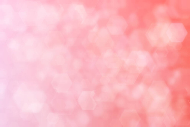 roze en oranje abstracte onscherpe achtergrond, zeshoekige vorm bokeh patroon. - Foto, afbeelding