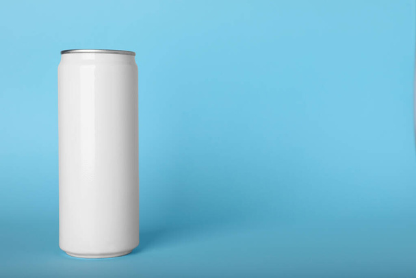 Can of energy drink on light blue background, space for text - Valokuva, kuva