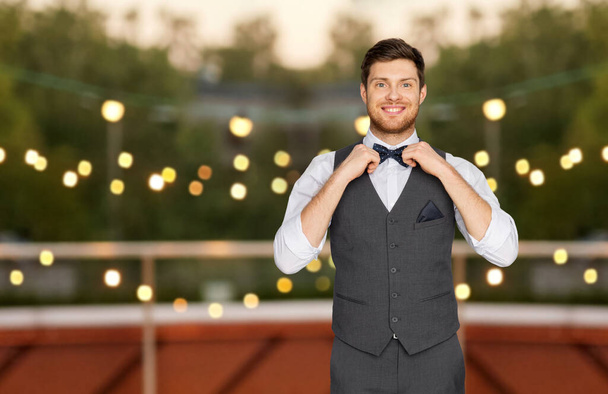 happy man in festive suit at rooftop party - Foto, Bild