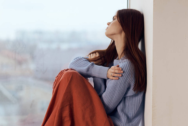 woman sitting on windowsill rest plaid morning lifestyle - Φωτογραφία, εικόνα