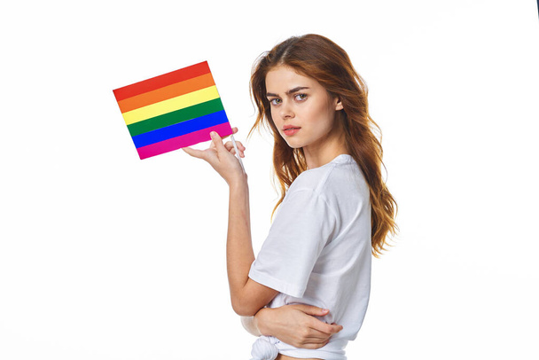 girl in white t-shirt lgbt flag transgender posing light background - Foto, immagini