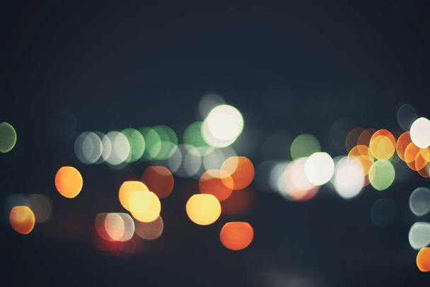 Abstract night city lights bokeh background. Soft defocused lights - Photo, Image