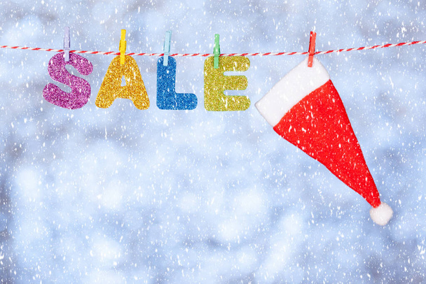 New year and christmas sale lettering on gray-blue glittering background - Foto, Bild