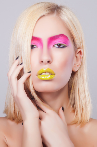 Fashion blonde supermodel in pink dress, closeup studio shot - Photo, image