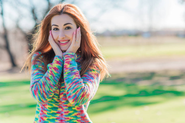 Woman in wool coat, colorful sweater, portrait of nice lady at city park, trendy concept - Photo, Image