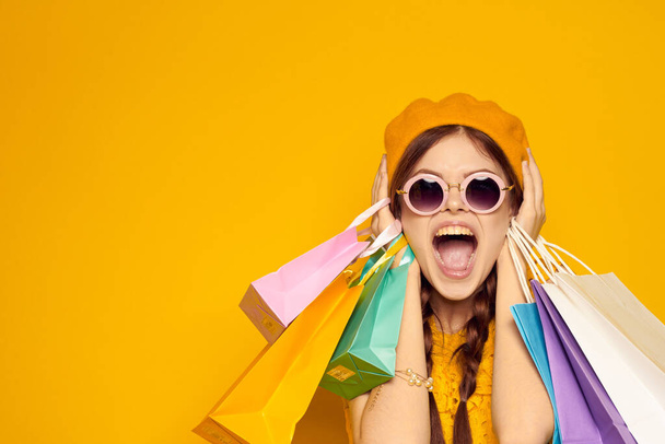 pretty woman in a yellow hat Shopaholic fashion style isolated background - Foto, Imagem