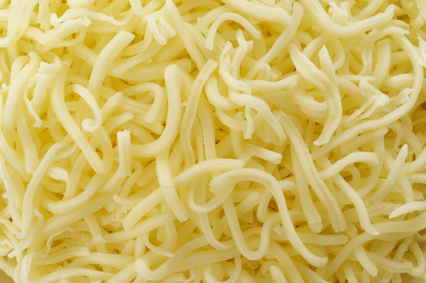 Primer plano del queso rallado fresco
 - Foto, Imagen
