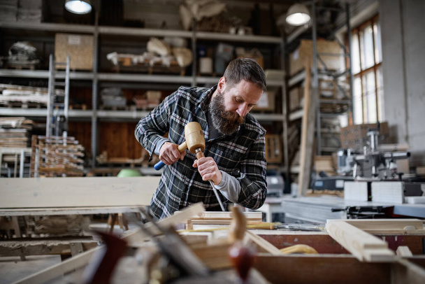 Portrait of mature male carpenter working on his product. Small business concept. - Fotografie, Obrázek