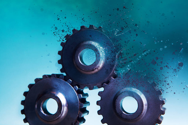 gears disappear on a blue background - Foto, immagini