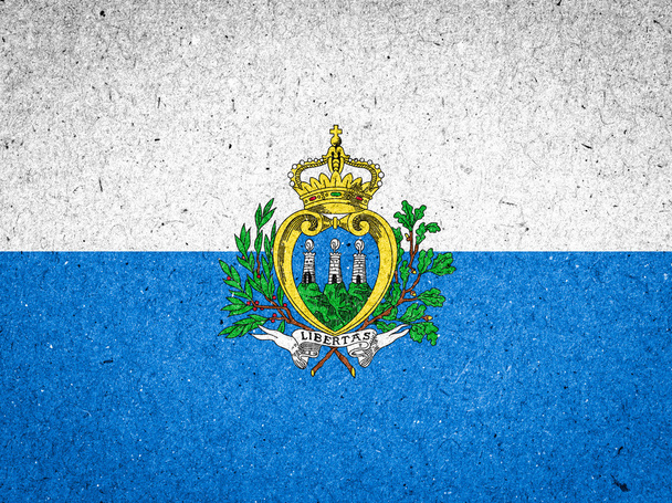 San marino vlag op papier achtergrond - Foto, afbeelding
