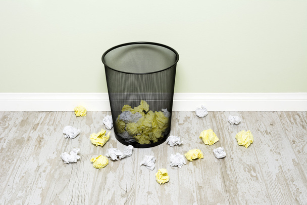 Wads of paper and trashcan - 写真・画像