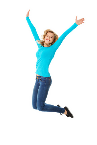Young casual woman, student jumping. - Φωτογραφία, εικόνα