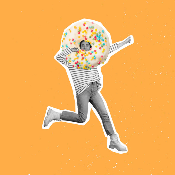 Contemporary art collage of woman with colorful sweet donut head isolated over orange background - 写真・画像