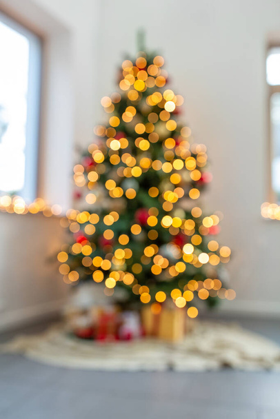 blurred christmas tree lights at home - 写真・画像