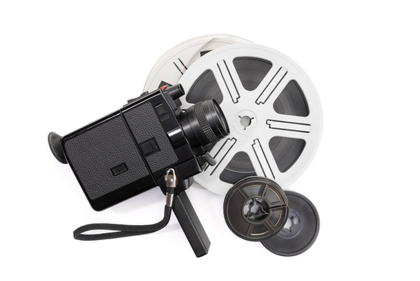 Super 8 camera and film reels isolated on white background. Copy space - Photo, Image