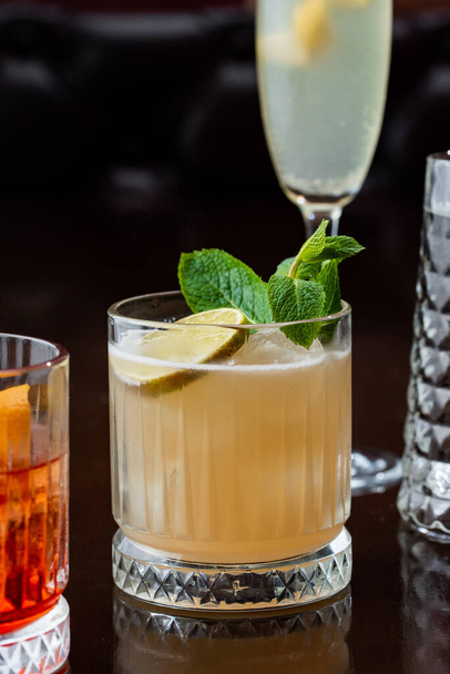 fresh cocktail with lemon on black background  - Foto, Bild