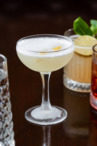 cold cocktail with lemon close up - Фото, изображение