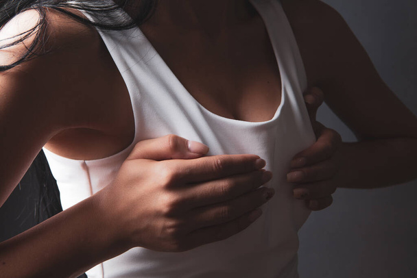 young woman sexually holding breasts - Φωτογραφία, εικόνα