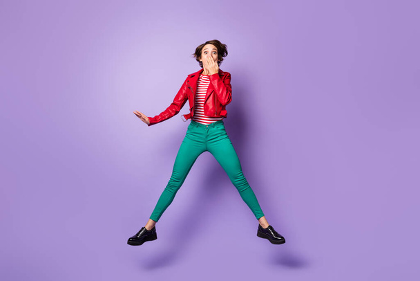 Full body photo of young woman amazed shocked surprised cover hand mouth jump isolated over purple color background - Φωτογραφία, εικόνα