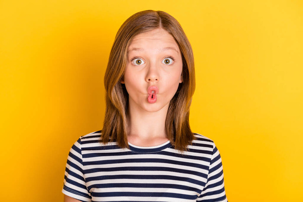 Portrait of carefree positive pupil lips make fish face have fun look camera isolated on yellow color background - Foto, Imagen