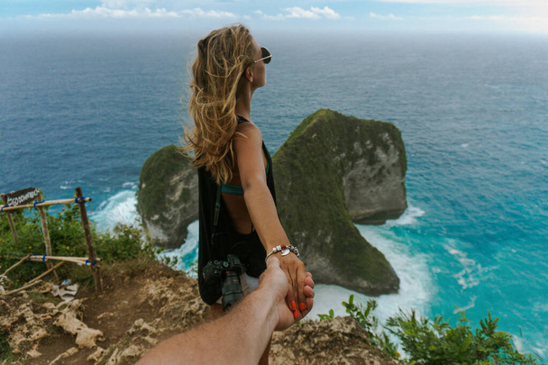 Woman wanting her man to follow her in vacation or honeymoon to  - Photo, image