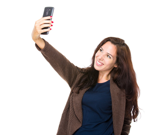 ブルネットの女性を取る selfie - 写真・画像