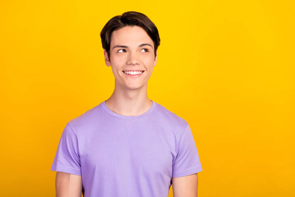 Portrait of attractive cheerful dreamy guy thinking copy empty space isolated over bright yellow color background - Fotoğraf, Görsel