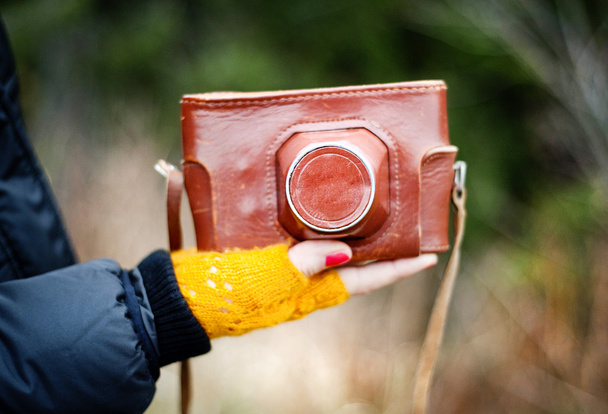 Hand holding retro camera - Фото, зображення
