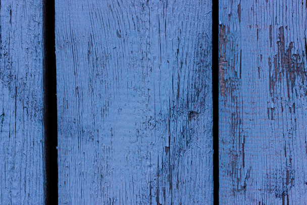 Old blue wooden shield. Burnt paint. The texture of wooden boards. - Foto, afbeelding