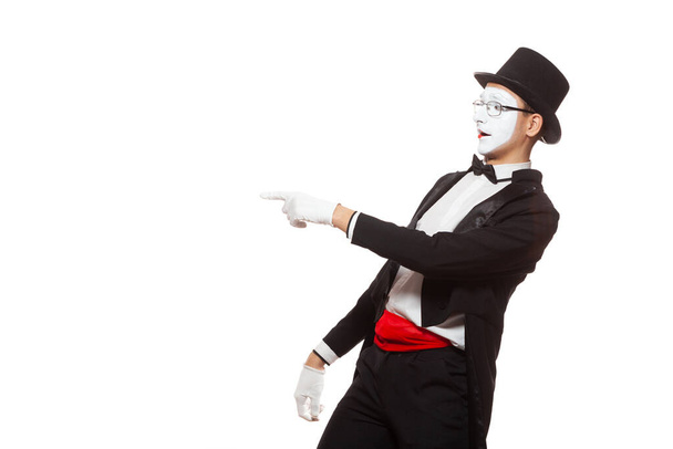 Portrait of a male mime artist performing, isolated on white background. Symbol of mockery, taunt, joke, laugh - Foto, afbeelding