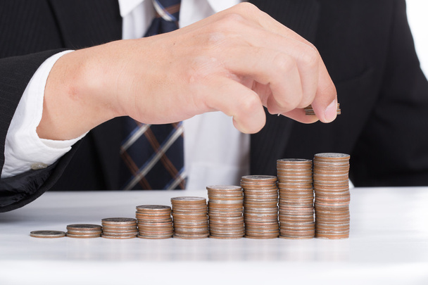 Business women put coin stack money - Foto, immagini