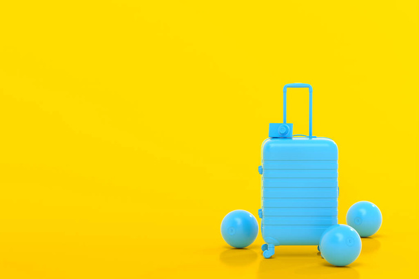 Suitcase with beach ball and flip flops on yellow background. - Valokuva, kuva