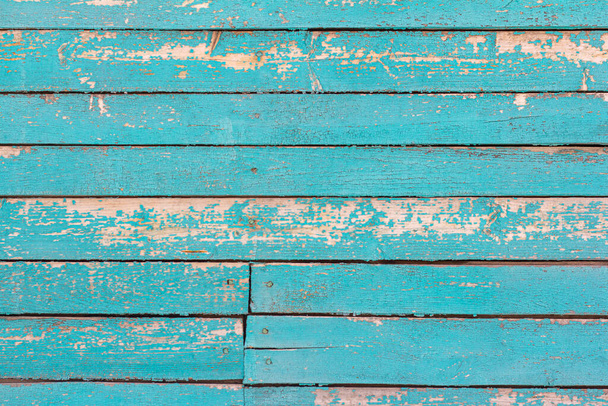 old wooden wall painted blue, weathered wooden background with nails and slits. - Zdjęcie, obraz