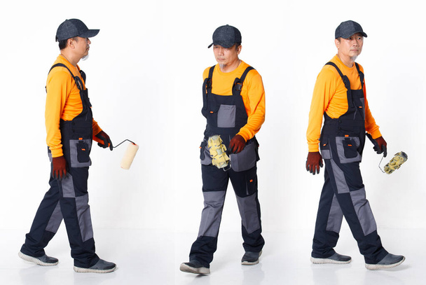 Senior Asian Man wear Orange uniform shirt hat and glove as painter labor, stand sit act painted. Full length of short small male hold brush painting roller many views, white background isolated - Photo, Image