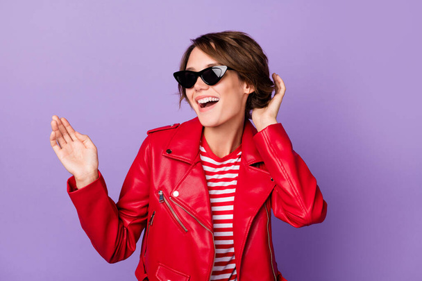 Photo of young attractive girl happy positive smile wear sunglass isolated over violet color background - Foto, afbeelding