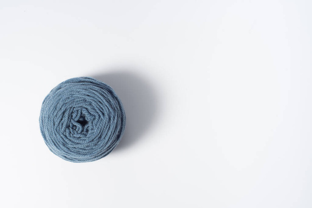 Large light blue ball of yarn on white background - Foto, afbeelding