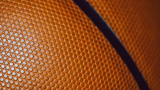 Nahaufnahme der Oberflächenstruktur eines Basketballs in Standardgröße. - Foto, Bild