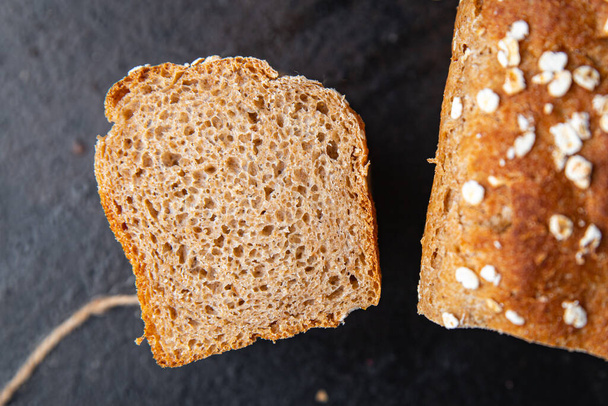 βρώμης ψωμί δημητριακά πίτουρο σιτάρι δεν μαγιά χρήσιμα συμπληρώματα σκληρό γεύμα σνακ στο τραπέζι αντίγραφο χώρο τροφίμων φόντο - Φωτογραφία, εικόνα