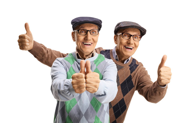 Happy elderly male twins showing thumbs up isolated on white background - Φωτογραφία, εικόνα