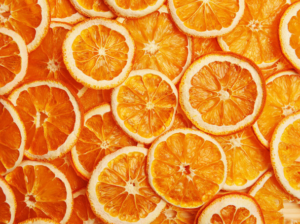 Dried orange slices full textured background. Decorative idea - Фото, зображення