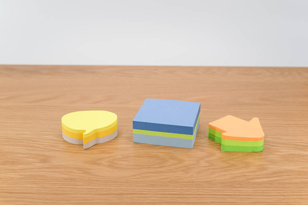 colorful sticky notes sheets for messaging and notes on a wooden background - Фото, зображення