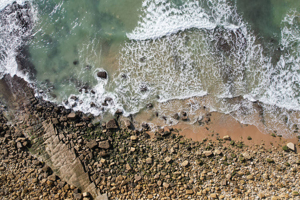 Beach and waves from top view. Turquoise water background. Summer seascape from air. Portugal Lagos Algarve. Travel concept and idea. - Photo, image