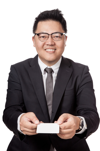 Asian businessman give a white card with both hand - 写真・画像