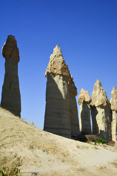 Beautiful mountains of bizarre form located in the heart of Cappadocia - Fotó, kép