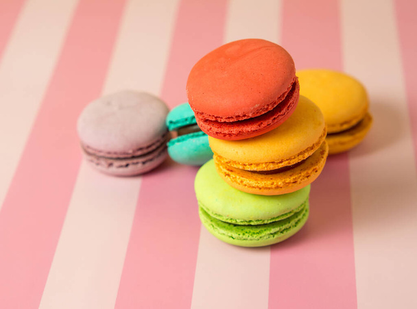 Fresh baked colored macaroon cookies macarons, macarons on a white plate close-up, - Photo, Image