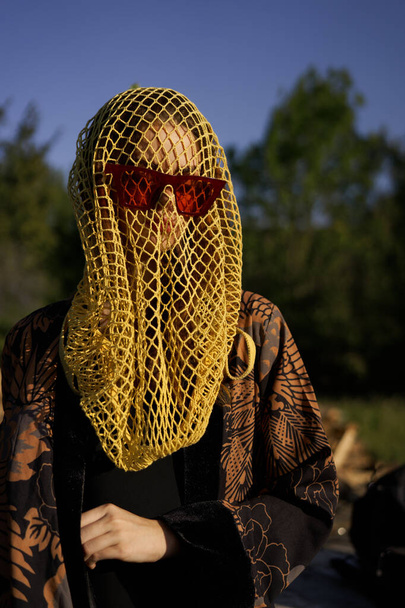 pretty woman wearing sunglasses veil dark background - Valokuva, kuva