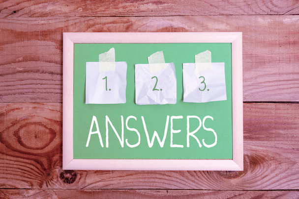 Text sign showing Answers. Word Written on Reactions responses to questions statements or situations Choices Display of Different Color Sticker Notes Arranged On flatlay Lay Background - Photo, Image
