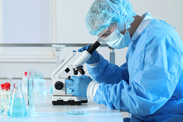Scientist working with microscope in laboratory. Medical research - Zdjęcie, obraz
