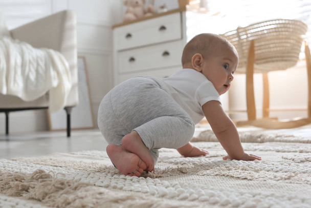 Cute baby crawling at home, focus on legs - Zdjęcie, obraz