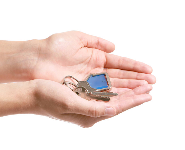 Nő kulccsal ház fehér háttér - Fotó, kép